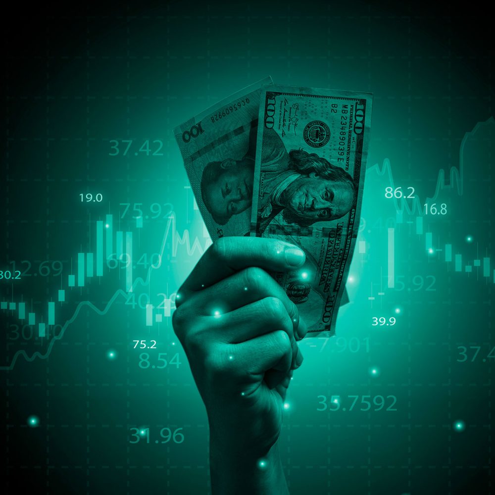 hand-holding-usd-dollar-banknote-with-stock-market-chart-increasing-arrow-dollar-exchange-money-exchange-inflation-interest-rating-increasing-concept